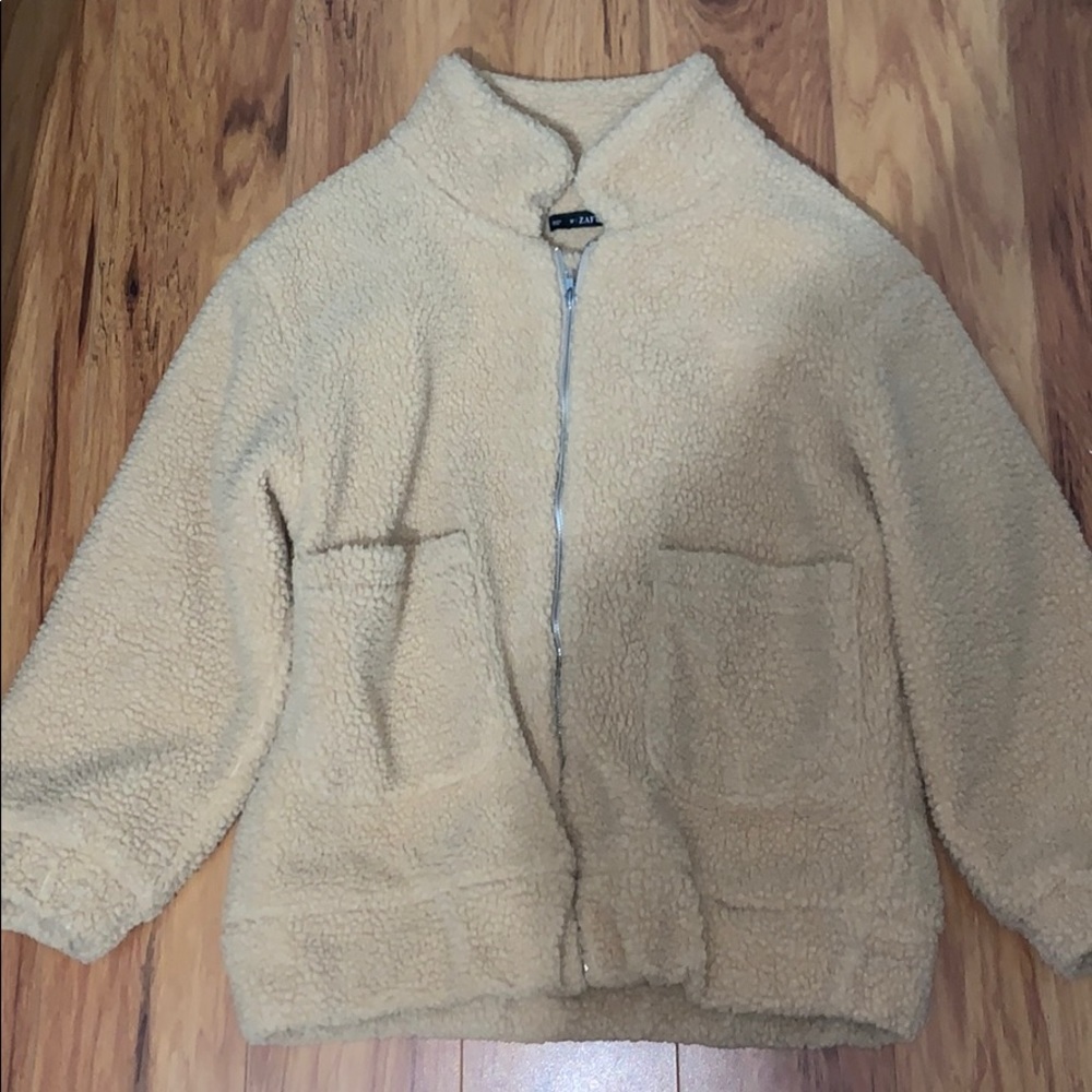 Medium sized tan fuzzy jacket